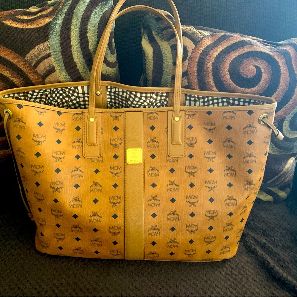 Large Tan Reversible MCM Tote. Very good condition.